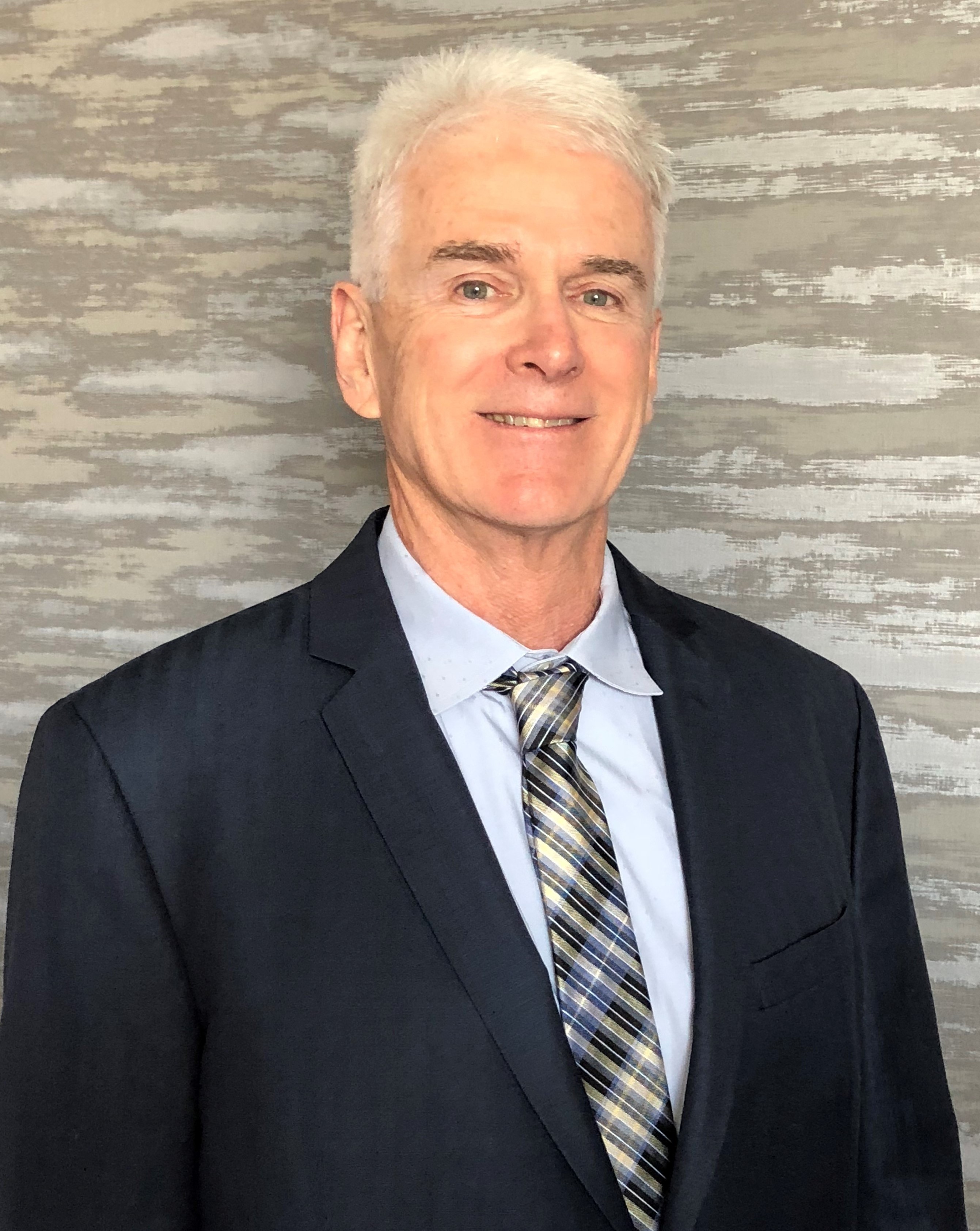 headshot of John Coggins