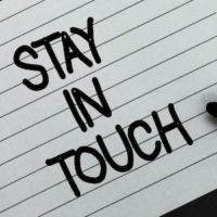 image of writing on paper saying "stay in touch"