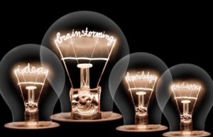 Image of lightbulbs with the wording: ideas, brainstorming, knowledge and vision
